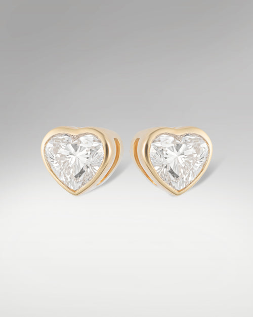 14k Yellow Gold Solitaire Heart Shape Diamond Studs at Lucid Diamond Co. Dallas