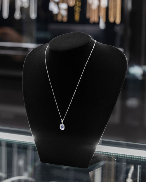 Women's Round Diamond and Tanzanite Oval Pendant Necklace at Lucid Diamond Co.
