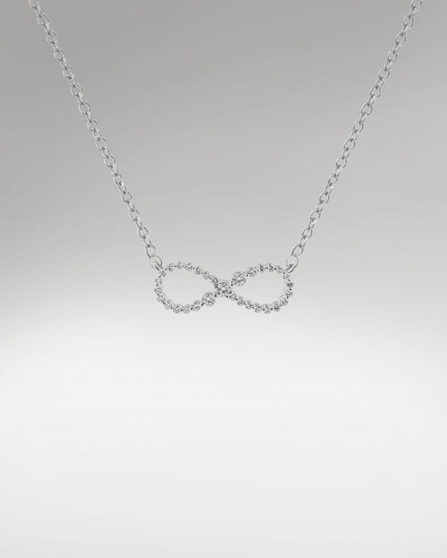 Women's Infinity Style Diamond Pendant at Lucid Diamond Co.